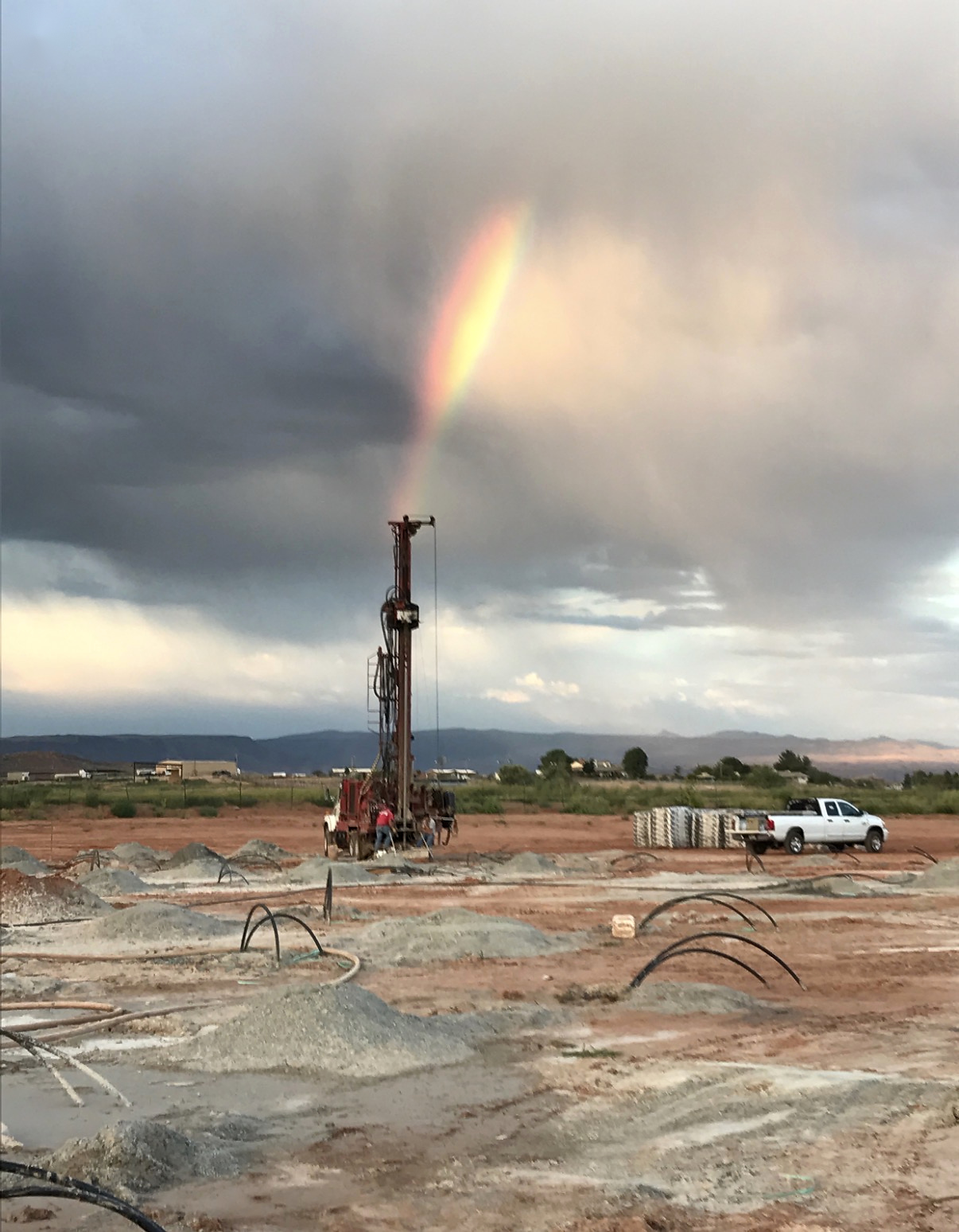 Geo Energy Systems geothermal drilling project under a rainbow in Utah